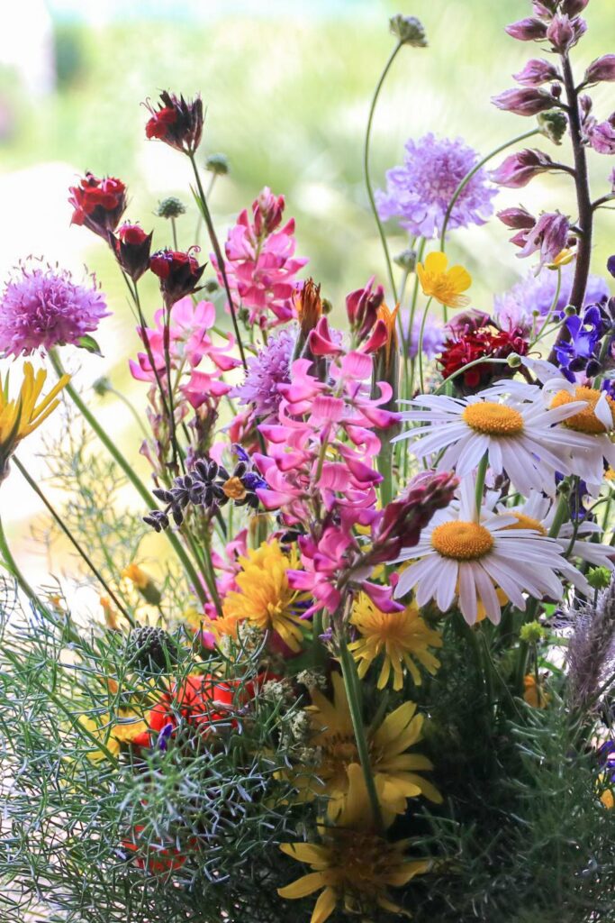 DIY wildflower floral arrangement with assorted flowers of pink, white, purple and yellow