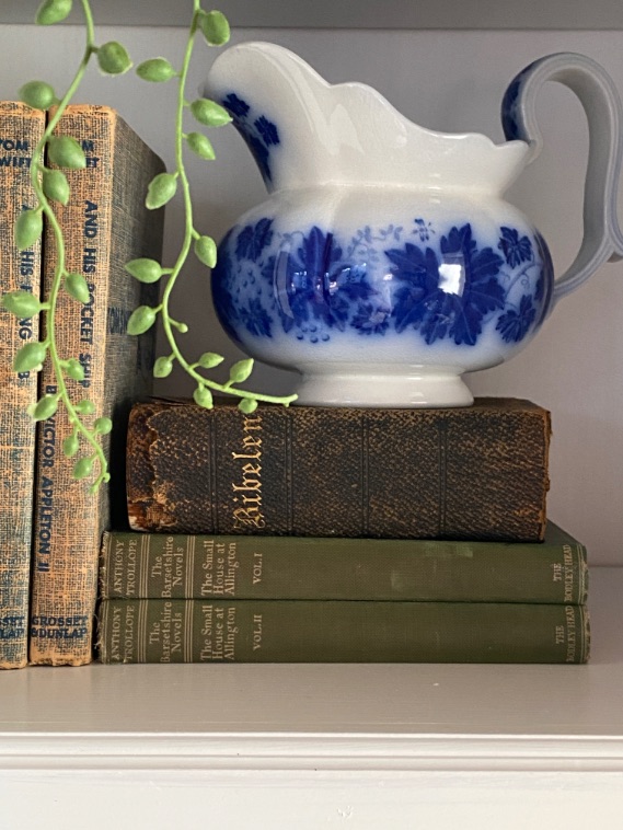 Blue and white decor on top of books 