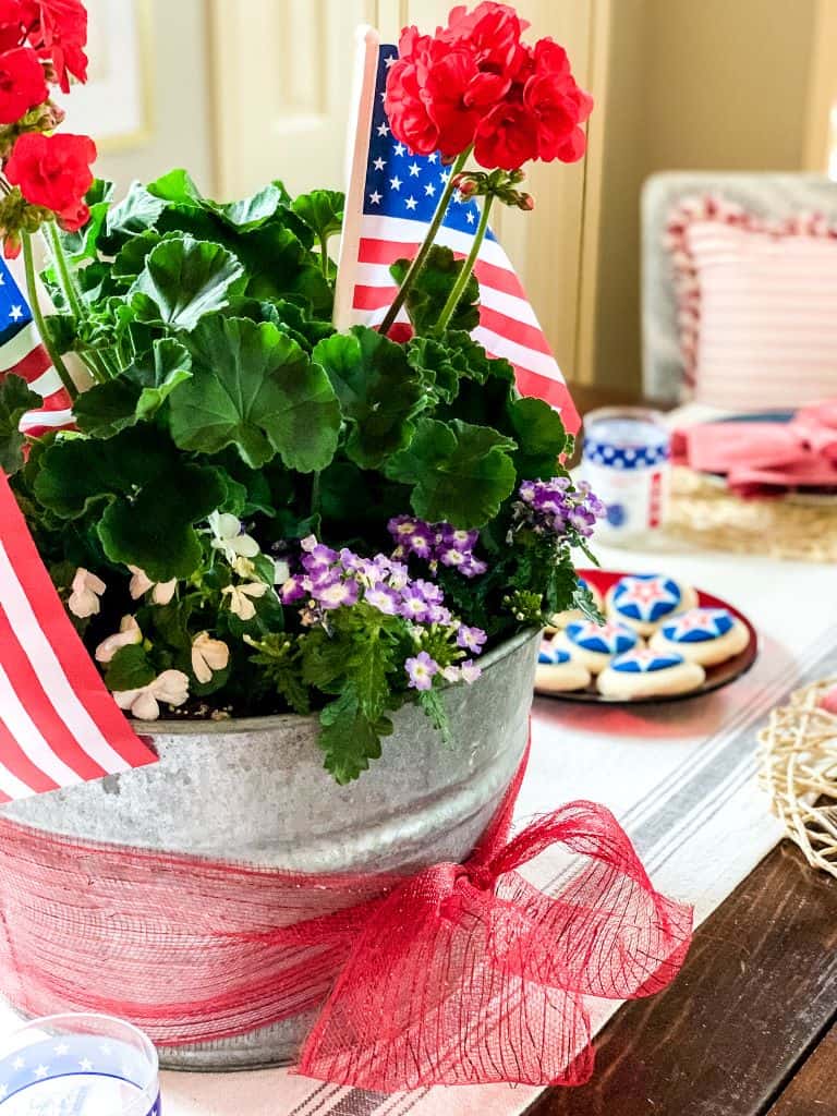 15 diy summer projects
A flower pot filled with greens and flags for the 4th of July 
