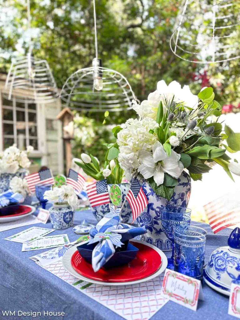 Table set for the Fourth of July with red, white and blue free printables. 