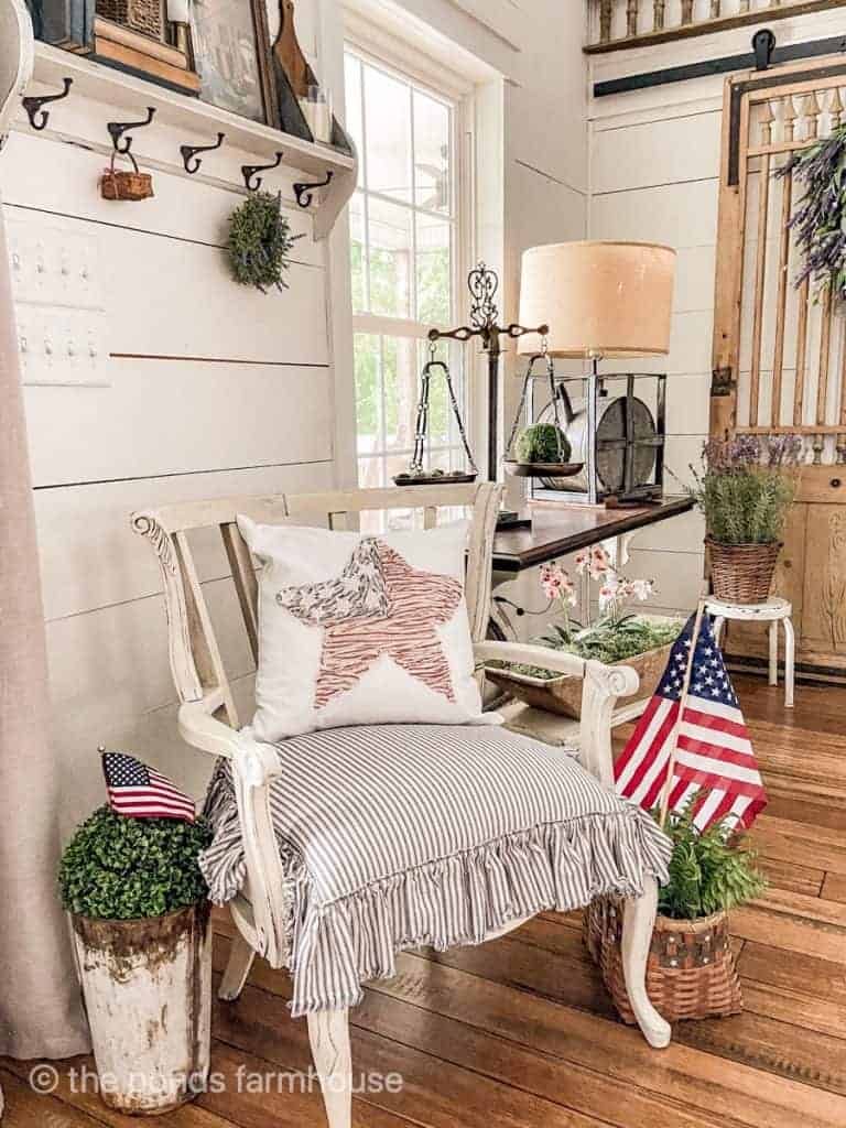 Darling no sew patriot pillow with a star sitting on a white chair in a bedroom 