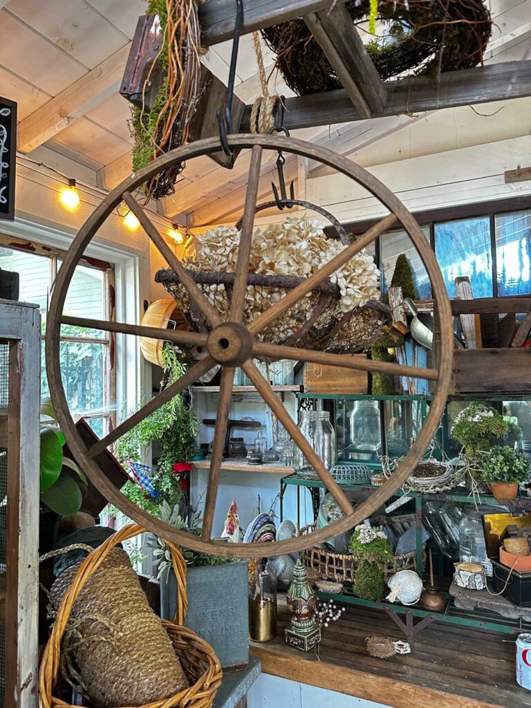 DIY Wagon wheel wreath - wooden wagon wheel hanging in the She-shed