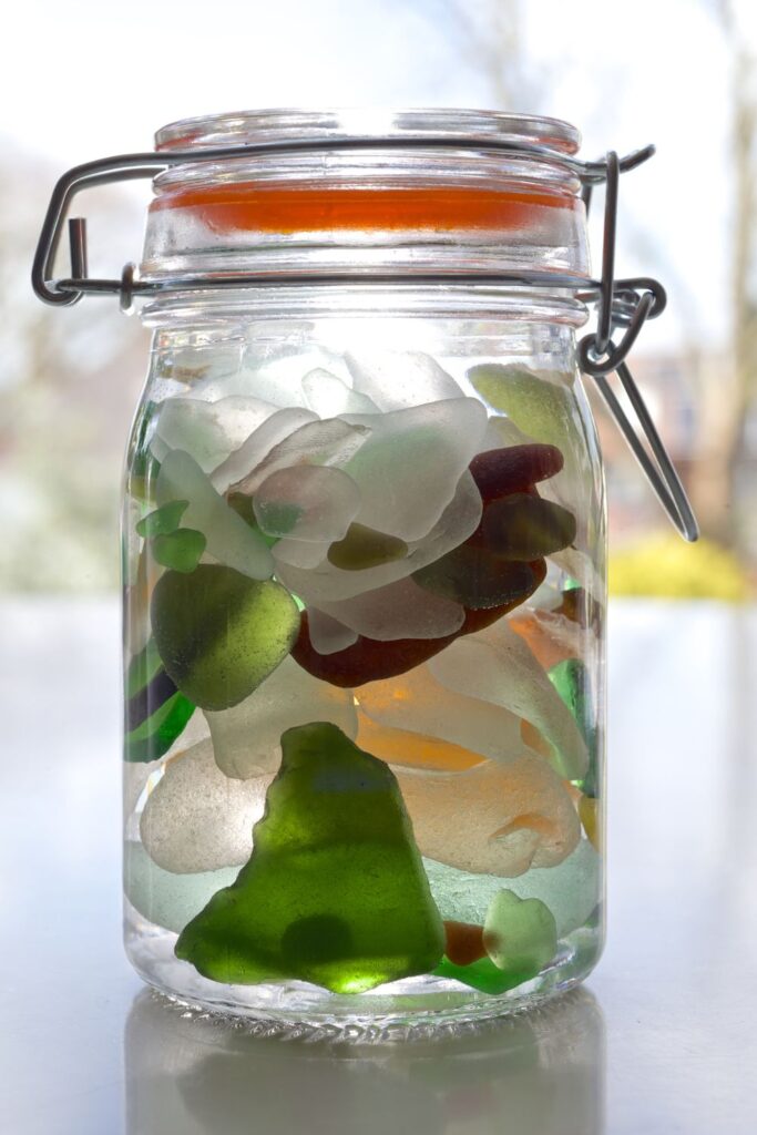 15 ways to use apotecary jars in the kitchen- jar full of seaglass 