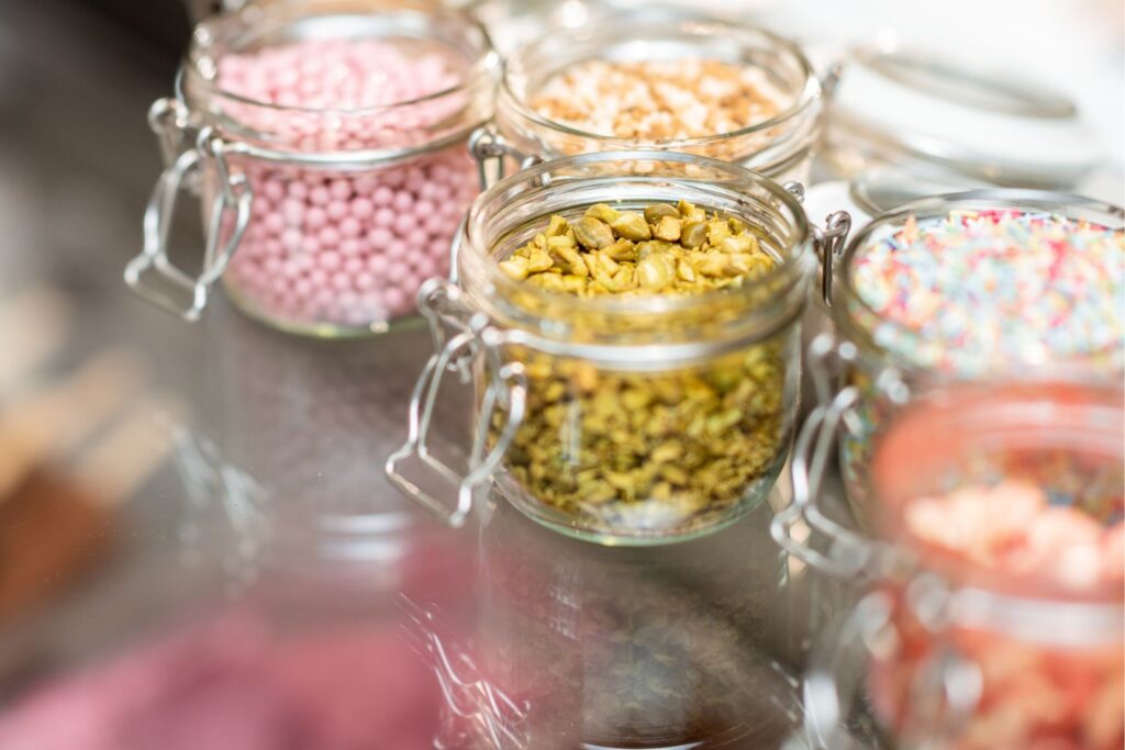 15 ways to use apotecary jars in the kitchen - small jars filled with ice ream toppings. 
