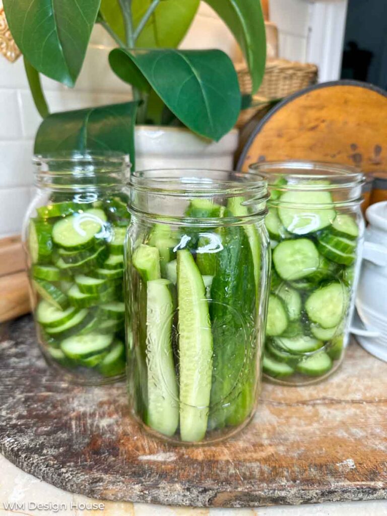 Mrs. Wages Dill Pickle recipe - three jars filled with cucumbers 