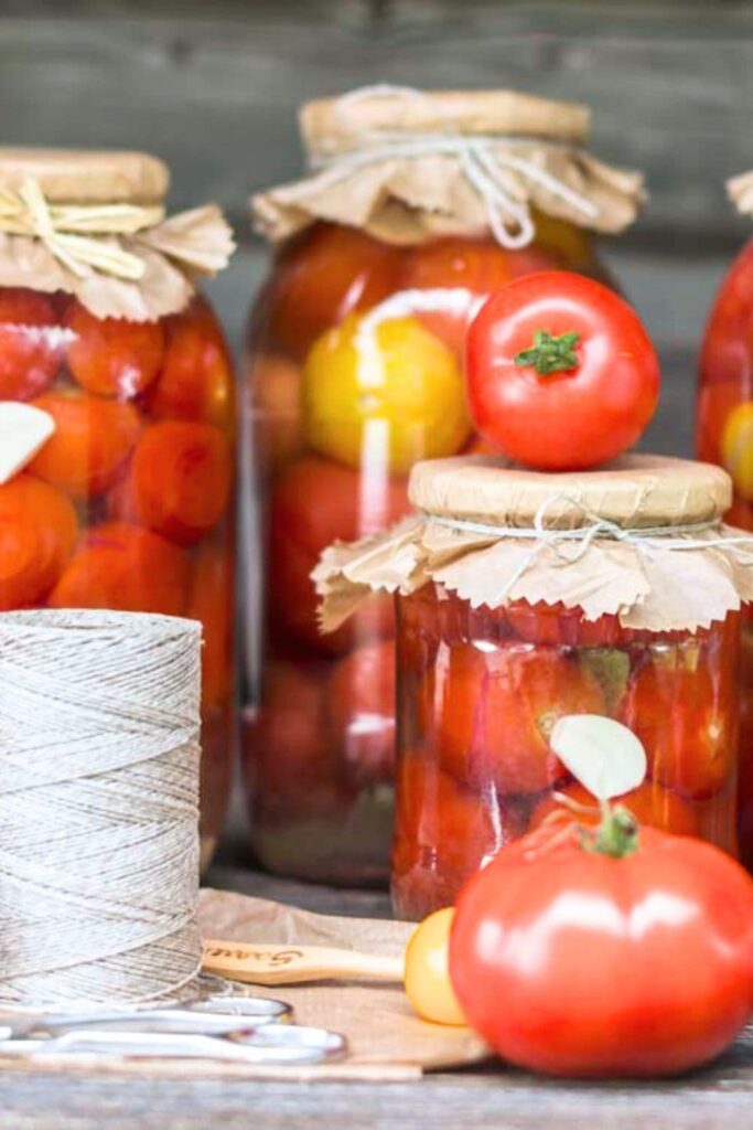 preserving tomatoes in jars and using for a decoration in the kitchen 