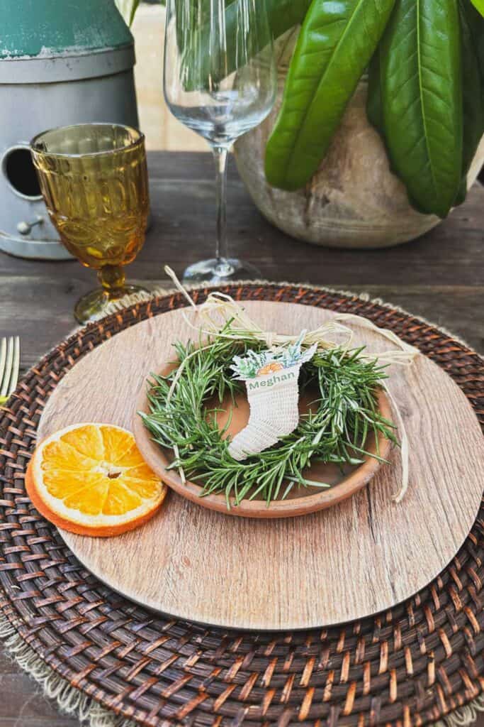 Fresh dried rosemary wreath with a stocking name card as a place card holder for Christmas dinner.