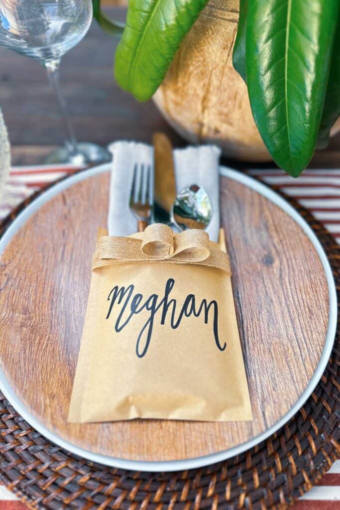 Hand written name card on silverware bag holder for Christmas DIY name place card holder. 