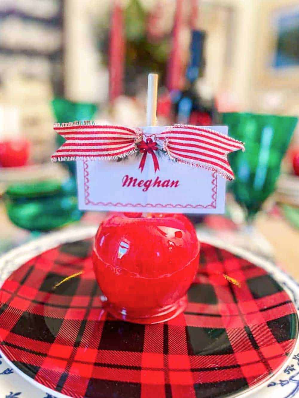 Red epoxy candy apple used for a name card holder on the Christmas dinner table.