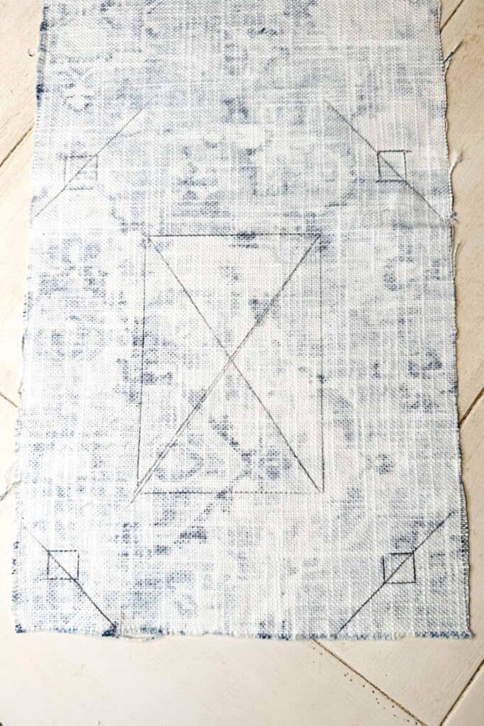 DIY fabric wall art- Fabric with markings to cut to cover a picture frame. 