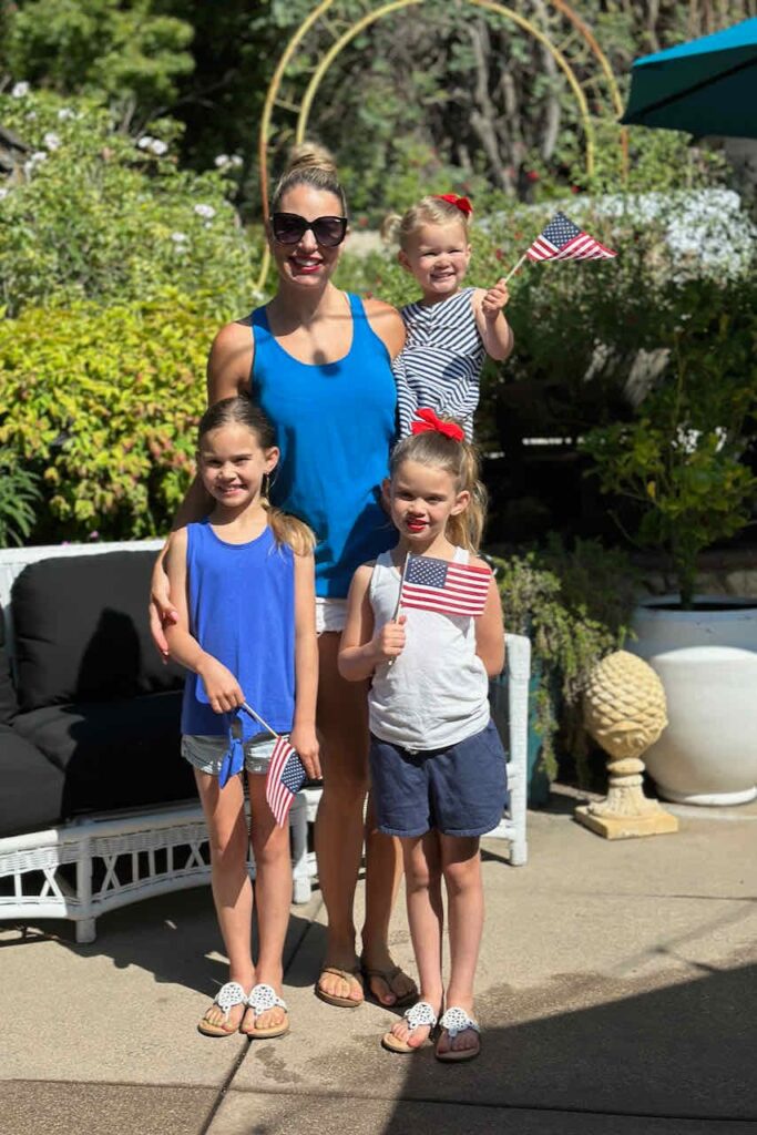 Mom with three girls dressed for the fourth of July 