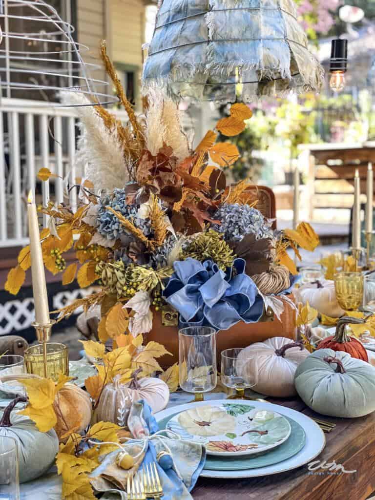 Table set for fall with dried flower arrangement 