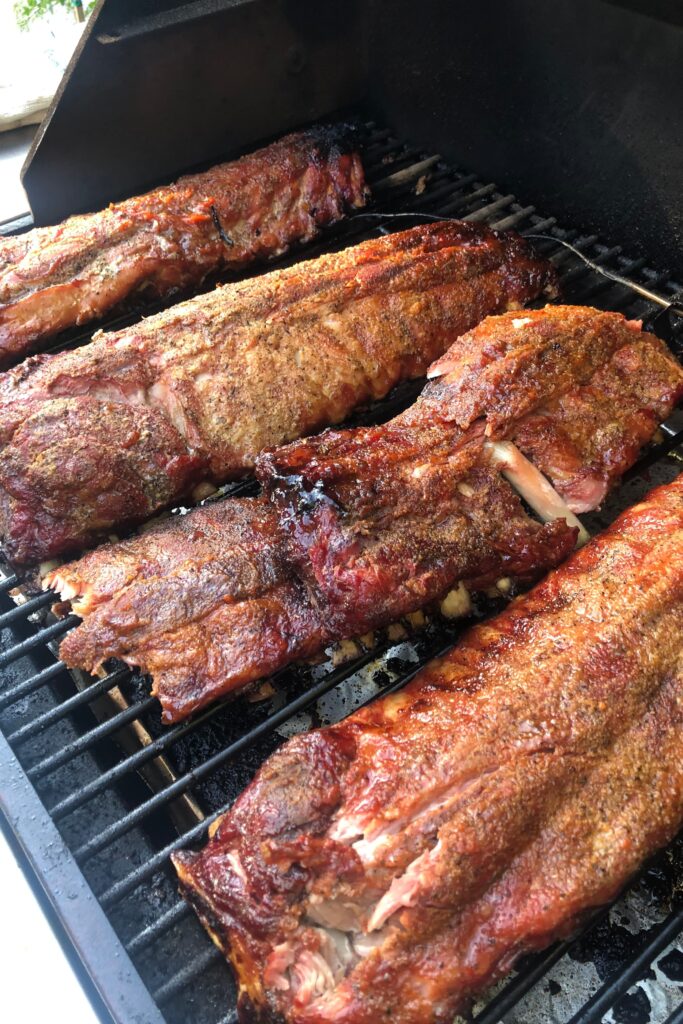 4 racks of ribs on the BBQ