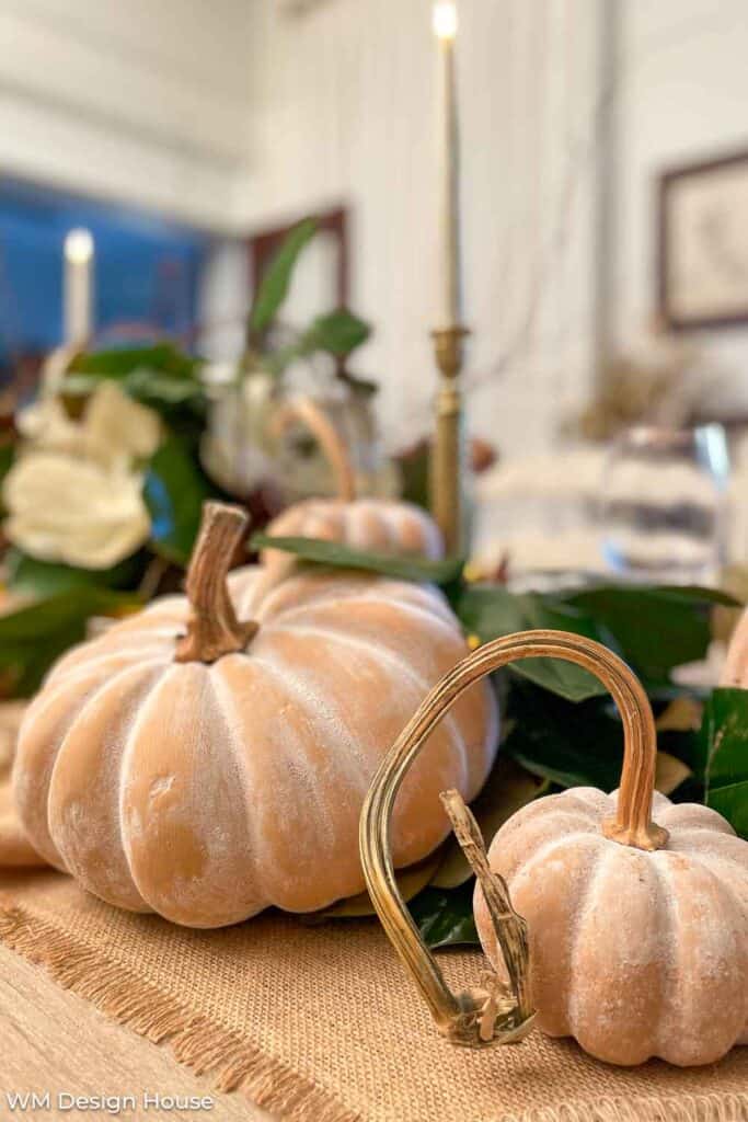 Terra cotta pumpkins on a ceramic cake plate 