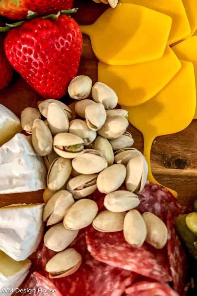 Pistachios on a charcuterie board 