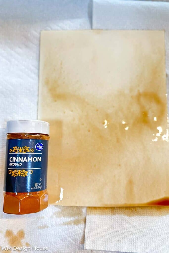 Cinnamon enhanced coffee dyed paper