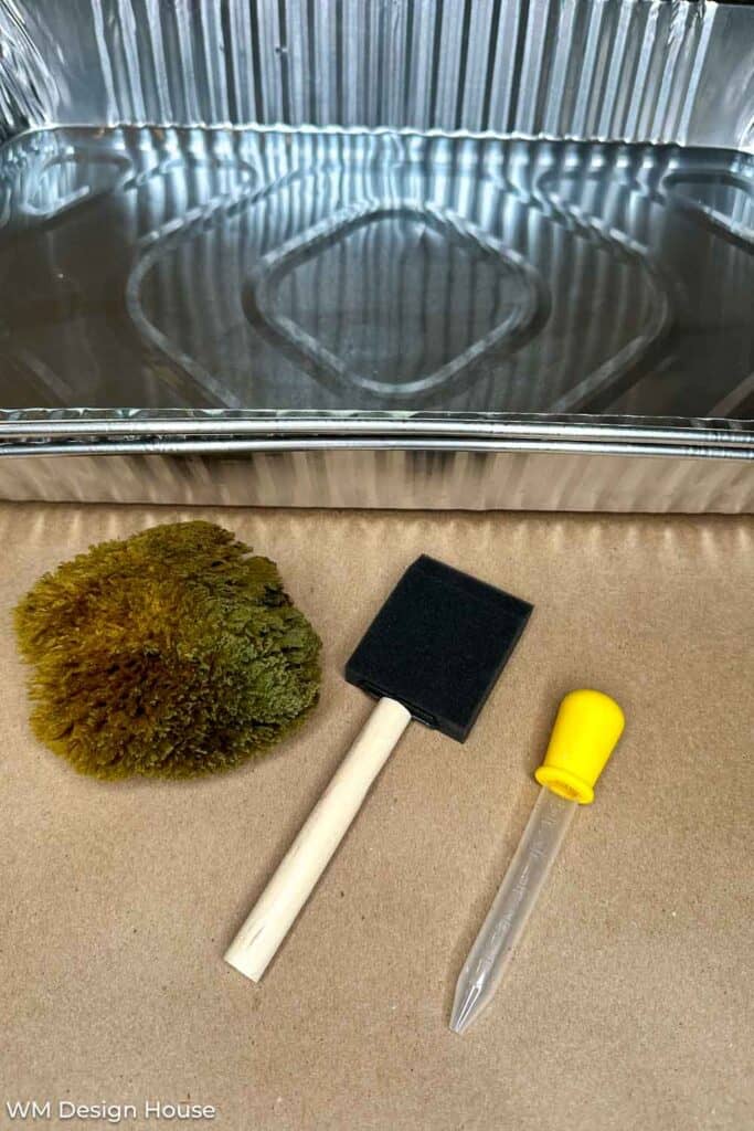 Aluminum pan, sponge brush, sea sponge and an eye dropper used to make coffee papper