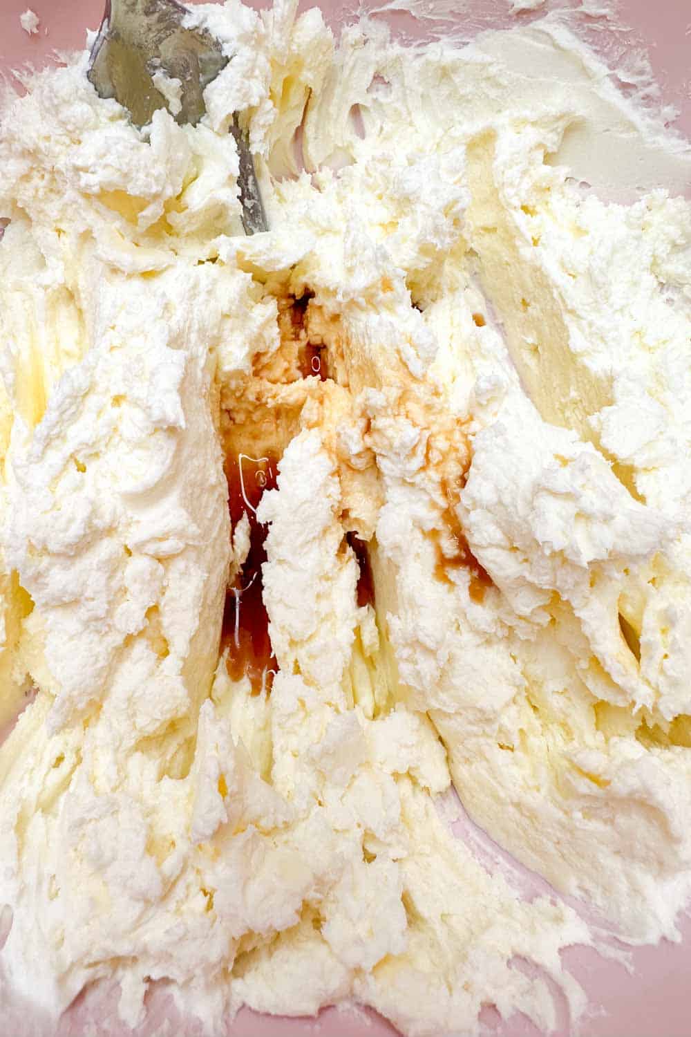 Mixing cream cheese, butter and vanilla