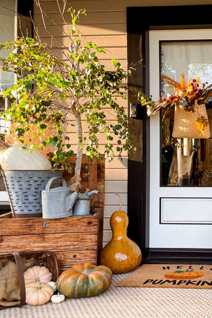 porch decorated for fall with flea market finds 