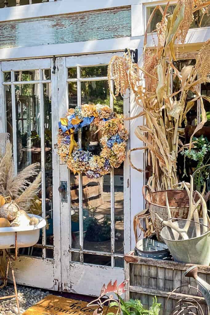 She shed with hydrangea wreath on the door 