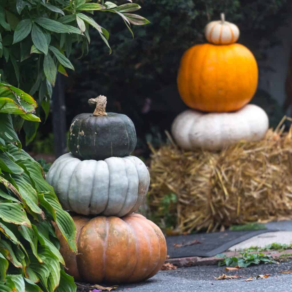 Stacked pumpkins are a wonderfully simple and budget-friendly way to achieve charming fall porch decor.
