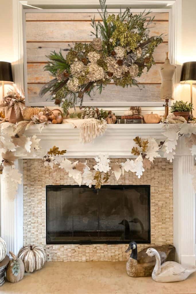 Dried floral wall arrangemnt hanging over the firelace in the family room 