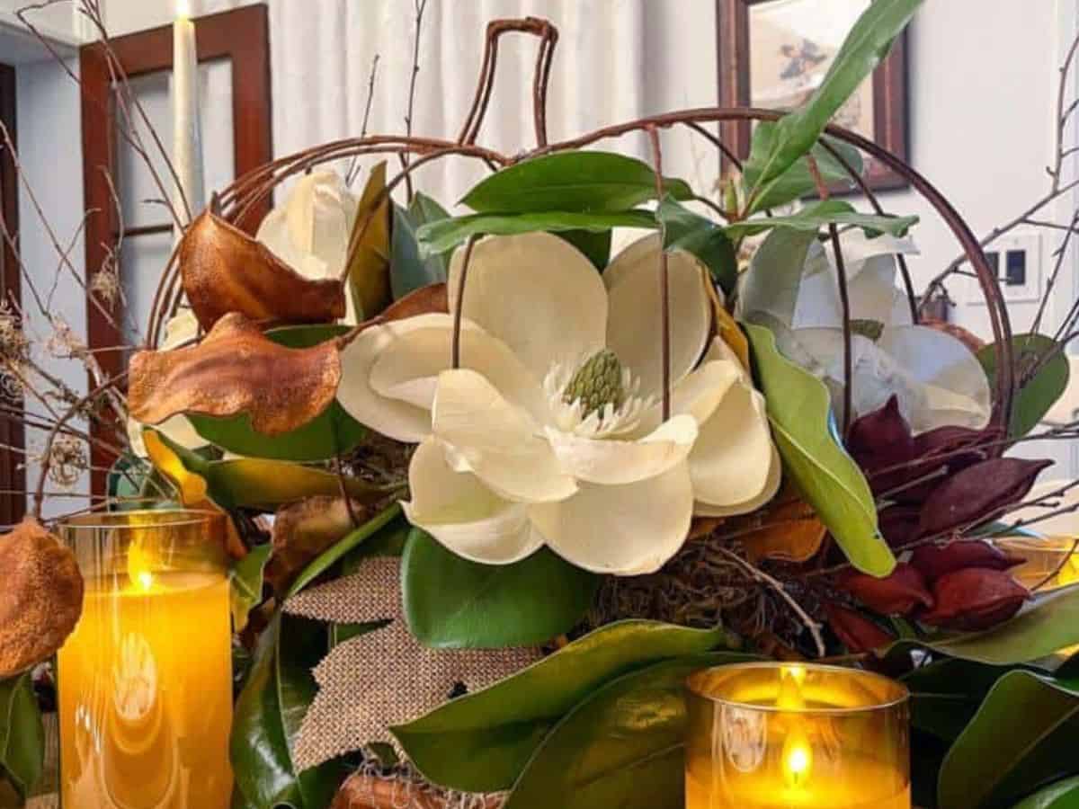 pumpkin and magnolia centerpiece for a fall tablescape