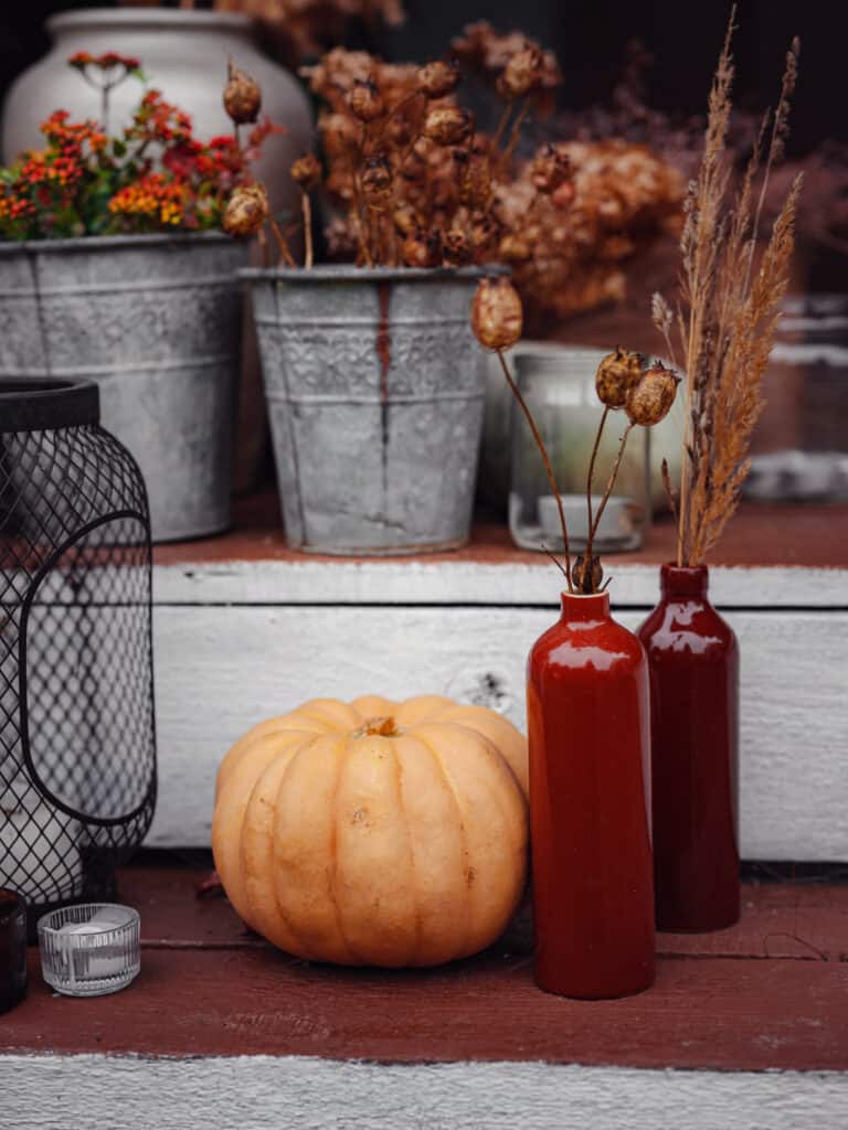 buckets and jars on the front porch steps