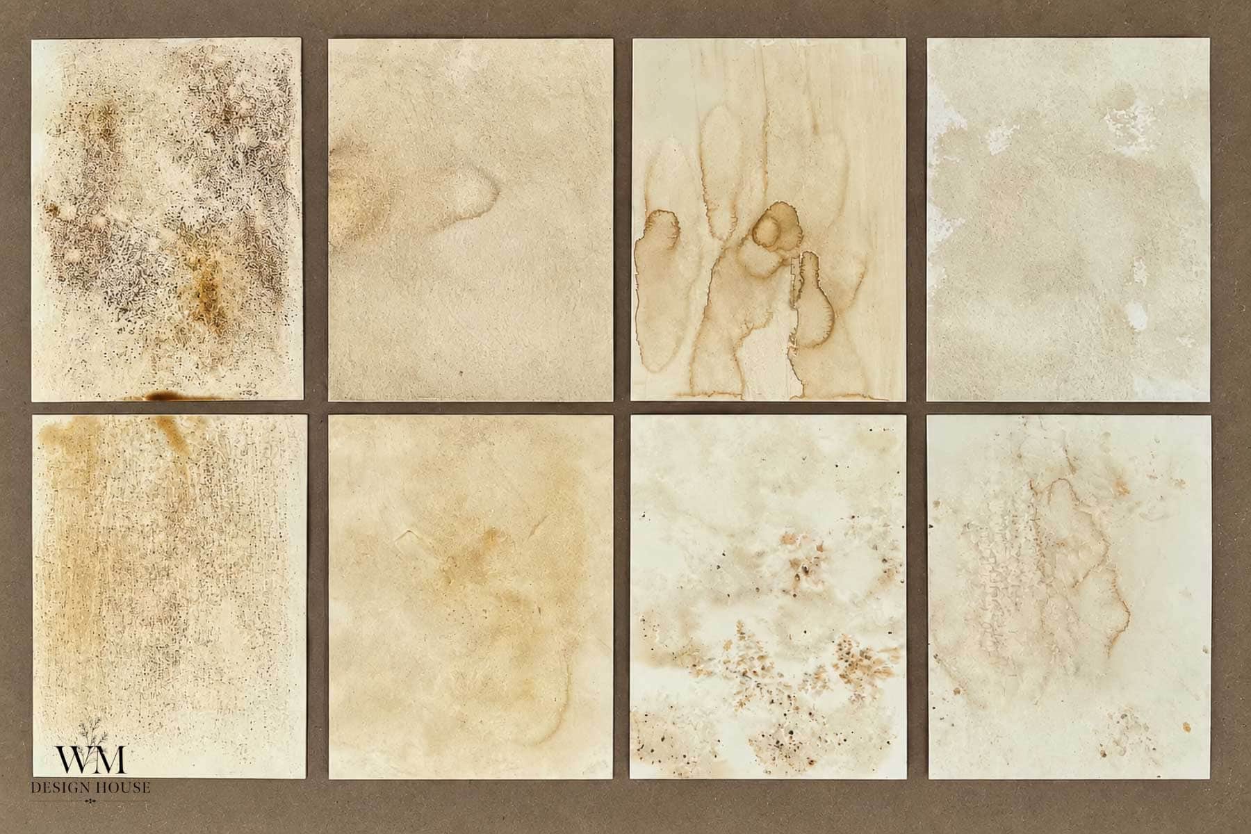 Eight aged, stained paper textures are arranged in two rows of four on a brown background, each with unique marks like water stains, splatters, and discolorations reminiscent of experimenting with how to make coffee paper. The bottom left features a “WM DESIGN HOUSE” logo.