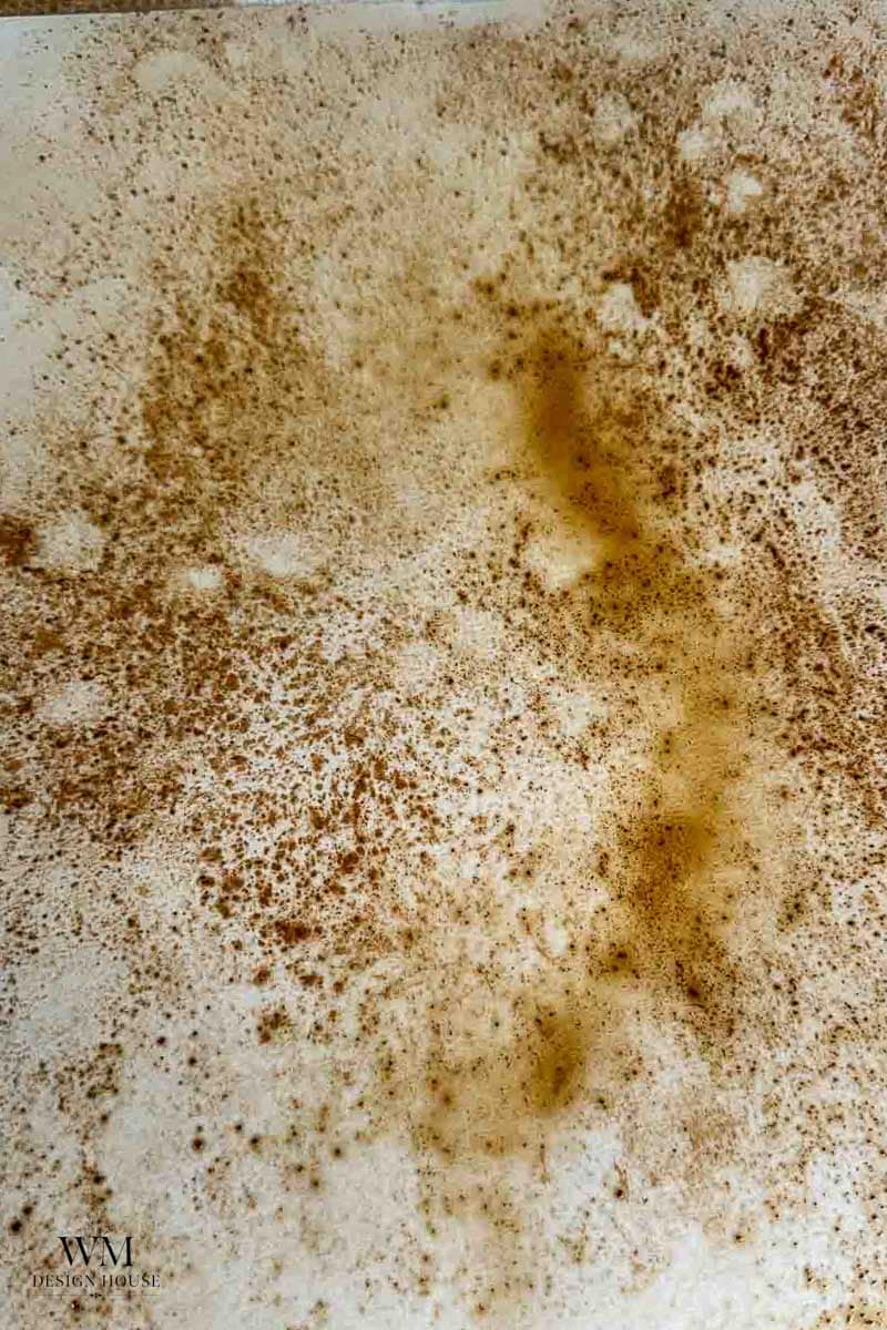 An image of making coffee stained paper with sprinkled instant coffee. 