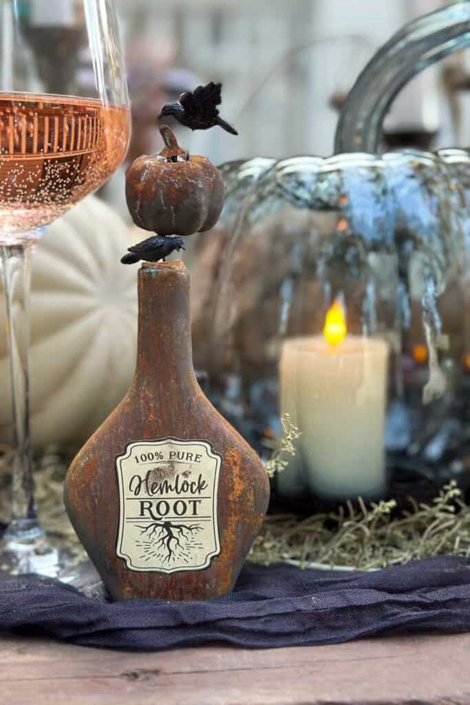 Rusty bottle favor is used as a decoration with an apothecary label.