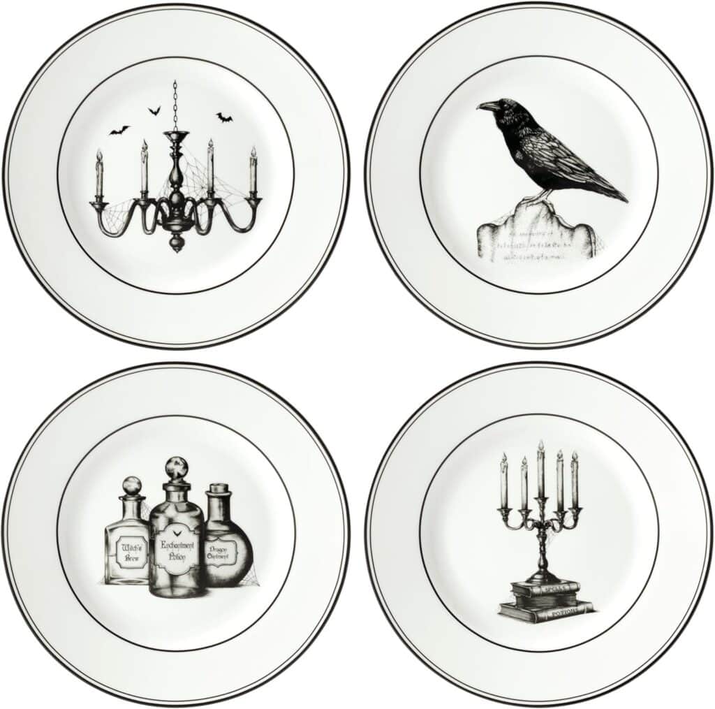 Set of four Halloween salad plates with candles, bottles, and crows.