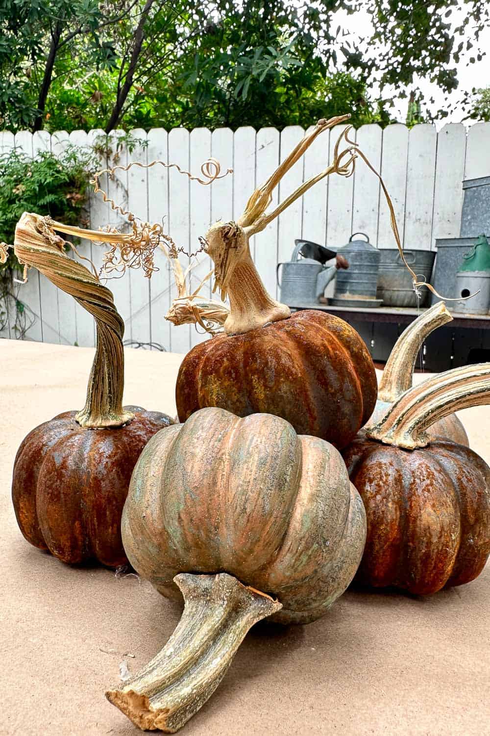 Beautiful Patina Pumpkins for Fall Using Metal Paint