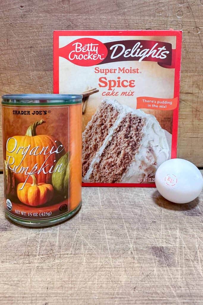 3 ingredieints to make pumkin cookies, egg, pumpkin in a can and a spice cake mix 