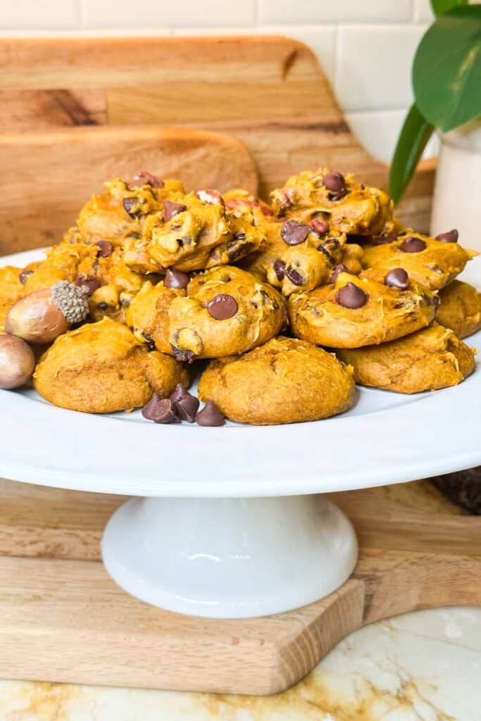 3 ingredient pumpkin cookies with chocolate chips on a cake plate