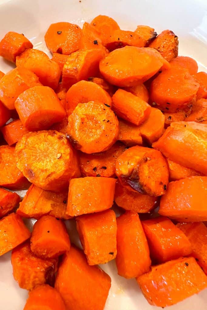 Roasted air fryer carrots in a white bowl.