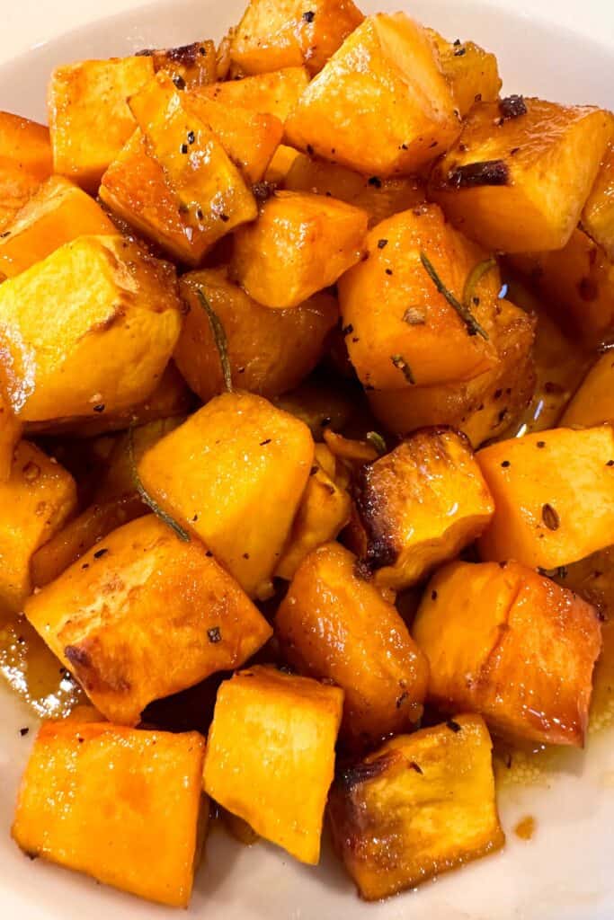 Roasted butternut squash with rosemary and seasoning.