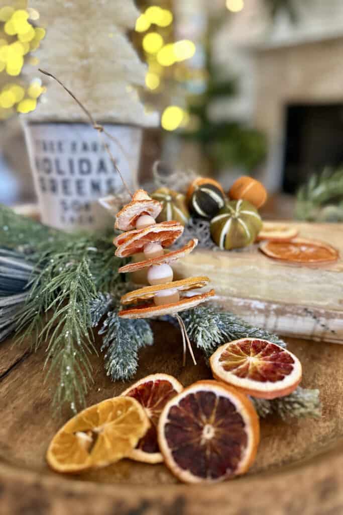 Dried oranges add a touch to a Christmas coffee table.