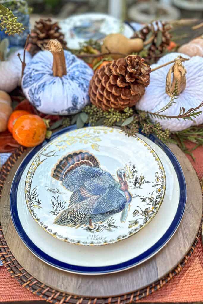 Blue and Orange Thanksgiving Table Decor Ideas-Beautiful turkey salad plates sitting on a Thanksgiving table.