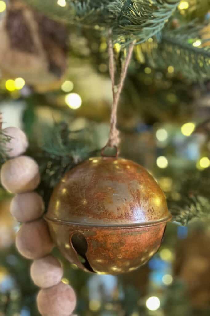 Rusty bell hanging in the christmas tree