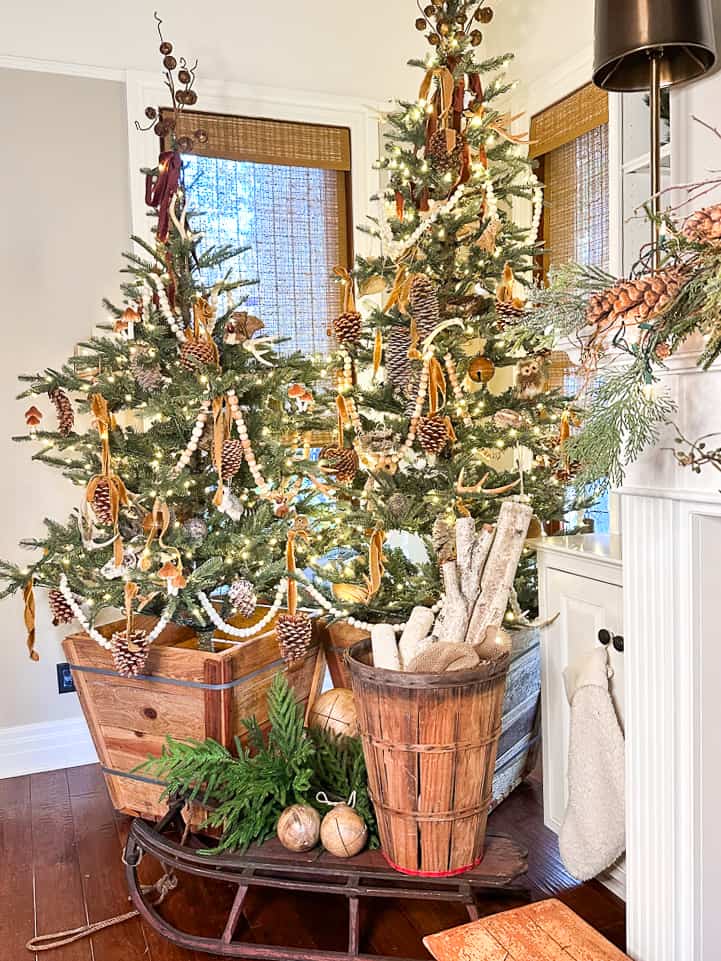 Christmas trees in the family room decorated with  green and gold decor ideas 