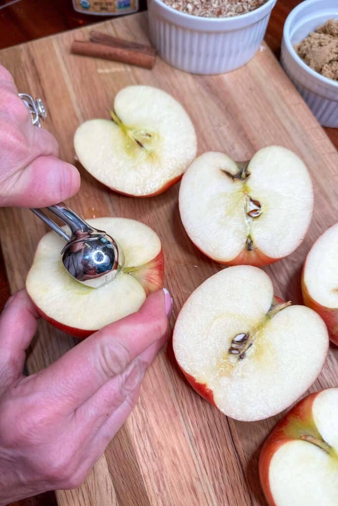 Coring apple halves to make baked apples