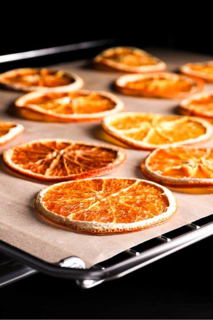 Dried orange sliced in the oven, ready to remove.