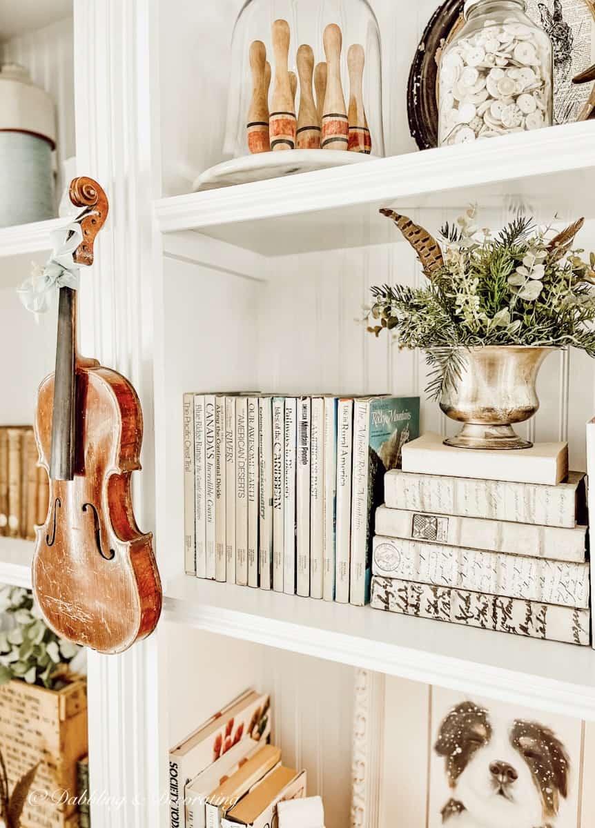 Bookshelf decor with thrifted items. 