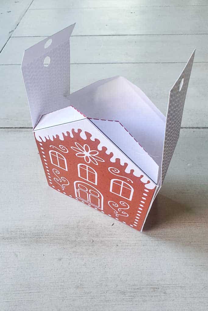 Free Printable gingerbread house, showing how to put the roof together.