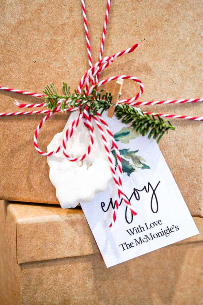 A personalized gift tag on a box of homemade vanilla almond granola.