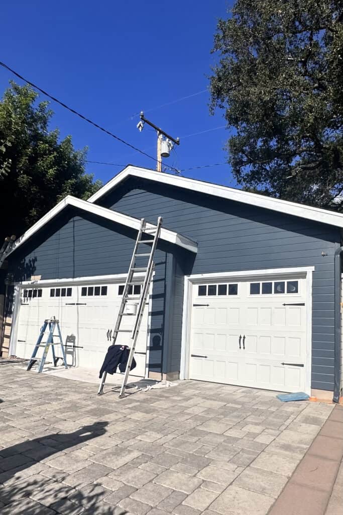 garage that is painted blue with white trim 