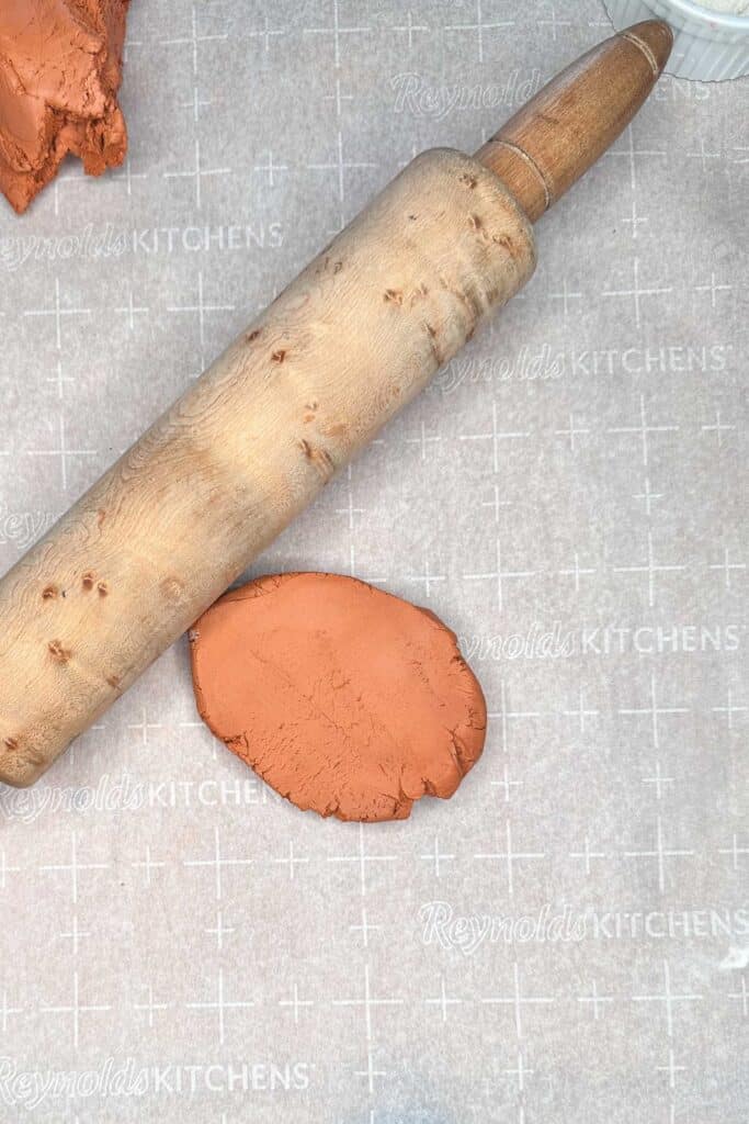 Rolling pin with clay.