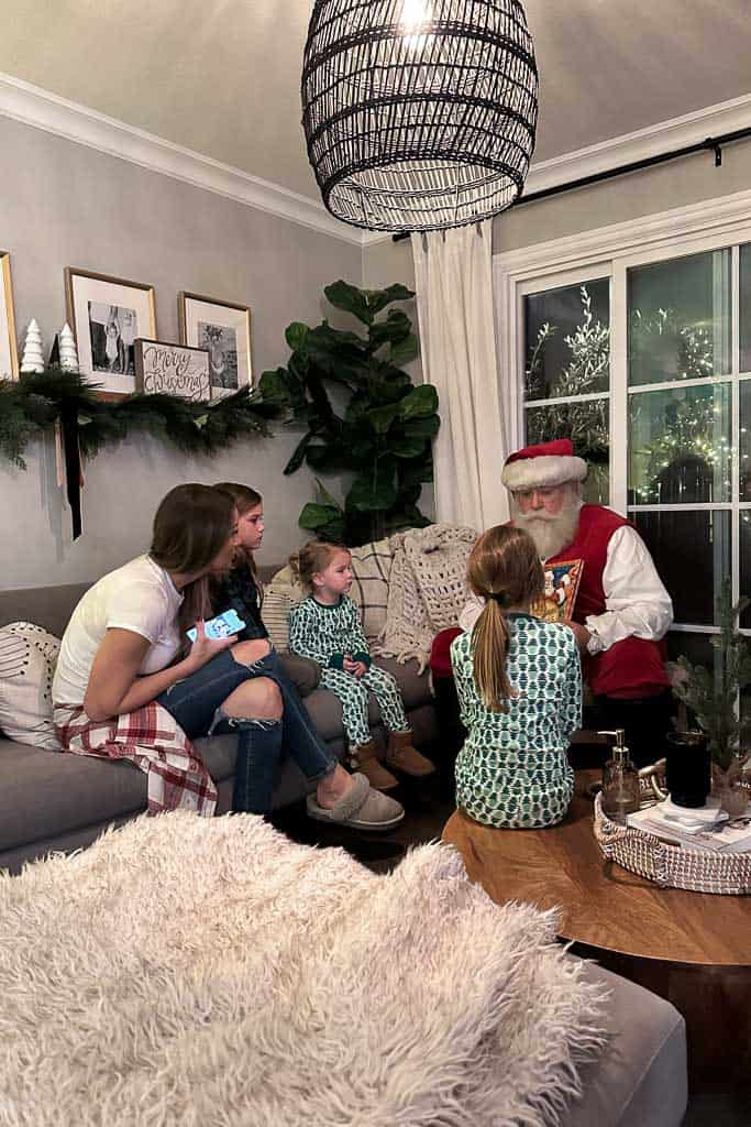 Santa reading a story to the girls 