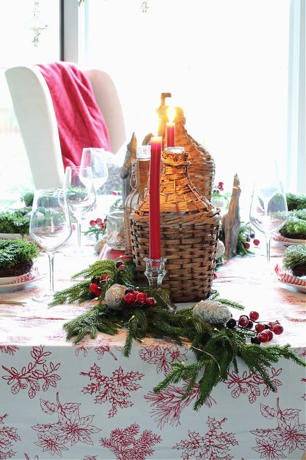 Vintage and Thrifted treasures -Jimmy Johns displayed on a Christmas table.